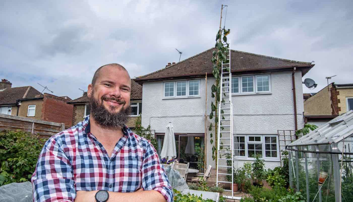 This English Dad Grew a Towering Sunflower Taller Than His 2-Story House-All Because His Son Asked Him To 