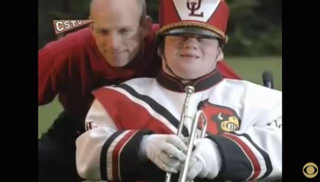 Father Pushes His Musically Gifted Son's Wheelchair In The University Of Louisville's Marching Band. 